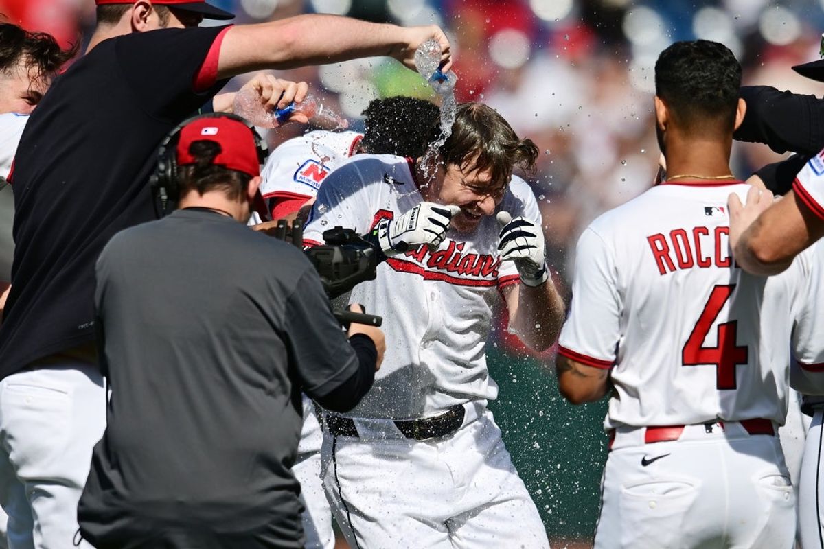 Aug 27, 2025; Cleveland, Ohio, USA; Cleveland Guardians designated hitter Kyle Manzardo (9) is doused with water after hitting the game winning RBI against the Tampa Bay Rays during the tenth inning at Progressive Field. Mandatory Credit: Ken Blaze-Imagn Images