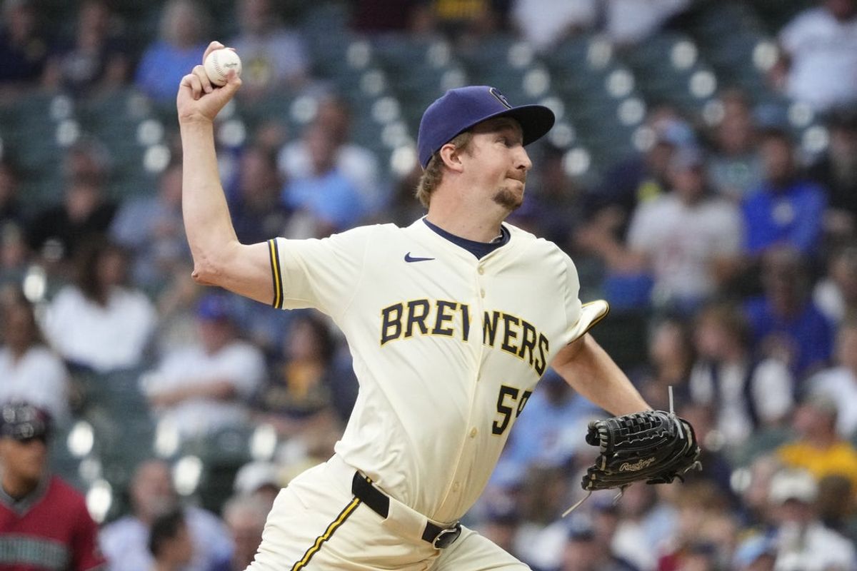 Aug 27, 2025; Milwaukee, Wisconsin, USA; Milwaukee Brewers pitcher Erick Fedde (59) delivers a pitch against Arizona Diamondbacks in the third inning at American Family Field. Mandatory Credit: Michael McLoone-Imagn Images