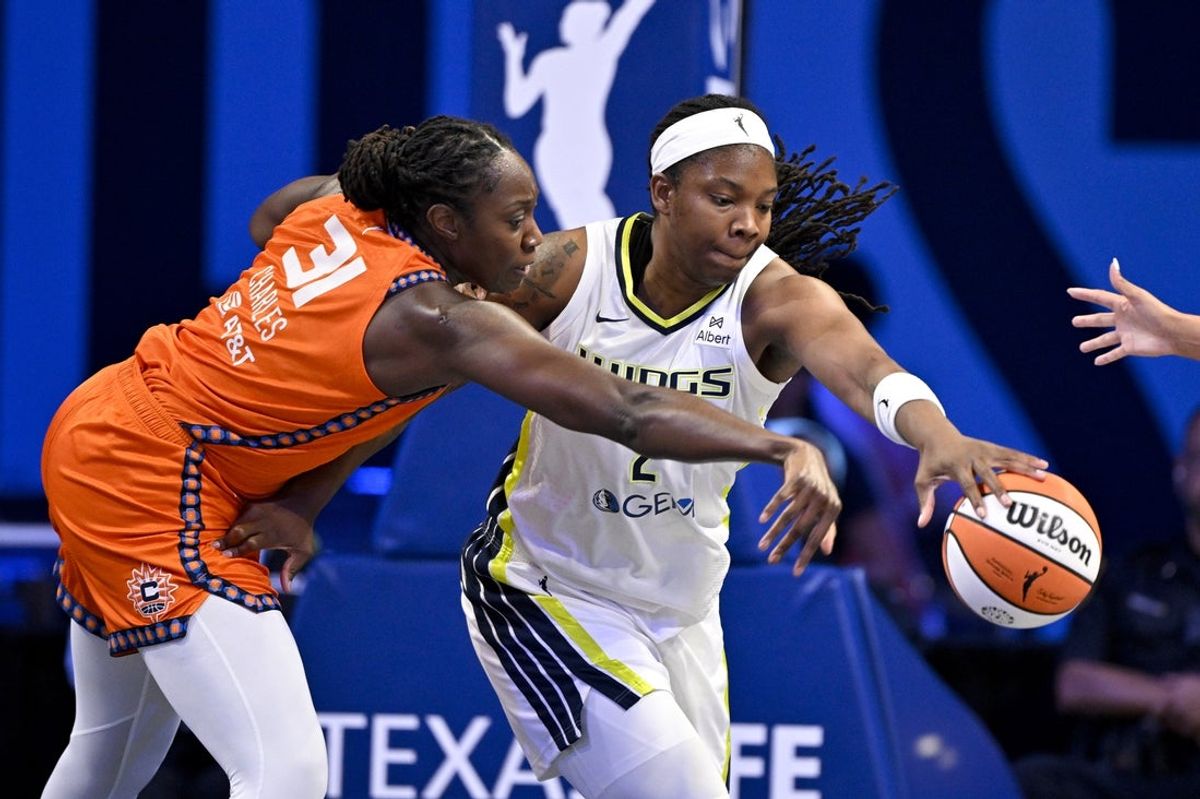 Aug 27, 2025; Arlington, Texas, USA; Connecticut Sun center Tina Charles (31) and Dallas Wings forward Myisha Hines-Allen (2) battle for the loose ball during the first half at College Park Center. Mandatory Credit: Jerome Miron-Imagn Images