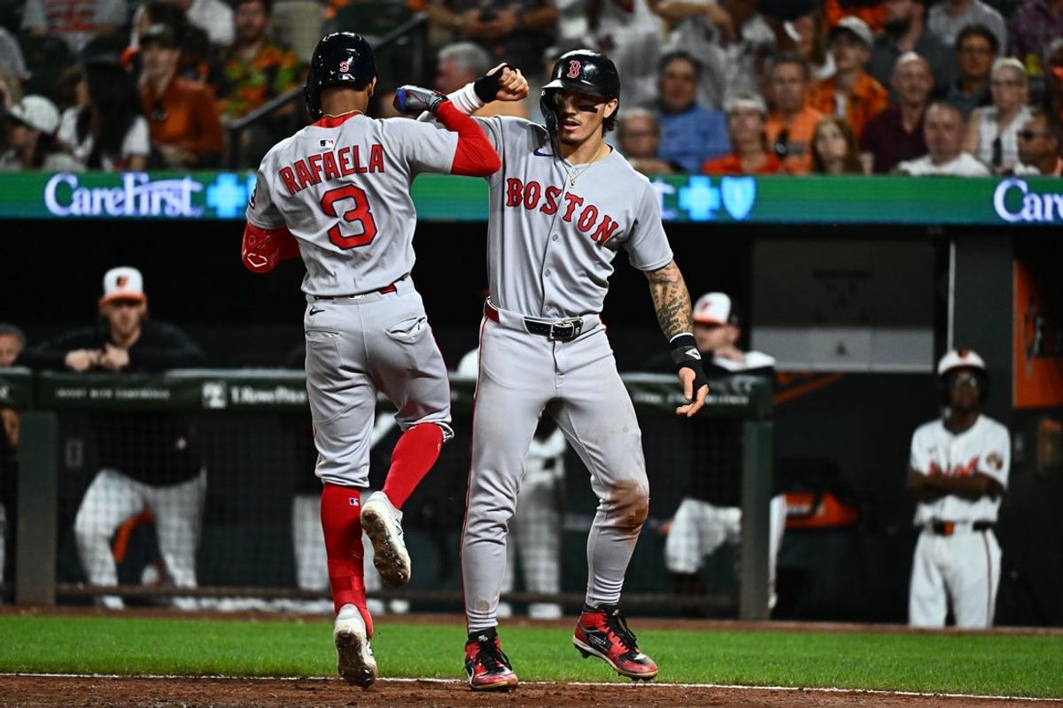 Aug 27, 2025; Baltimore, Maryland, USA;  Boston Red Sox outfielder Ceddanne Rafaela (3) celebrates with outfielder Jarren Duran (16) after hitting a two run home run during the ninth inning against the Baltimore Orioles at Oriole Park at Camden Yards. Mandatory Credit: James A. Pittman-Imagn Images
