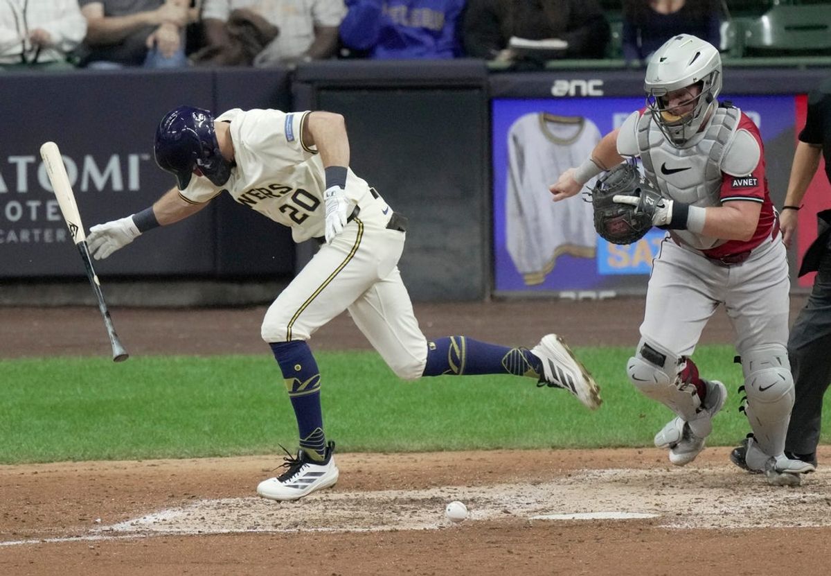 Arizona Diamondbacks catcher James McCann (8) fields a sacrifice bunt by Milwaukee Brewers outfielder Brandon Lockridge (20) during the seventh inning of their game Wednesday, August 27, 2025 at American Family Field in Milwaukee, Wisconsin.