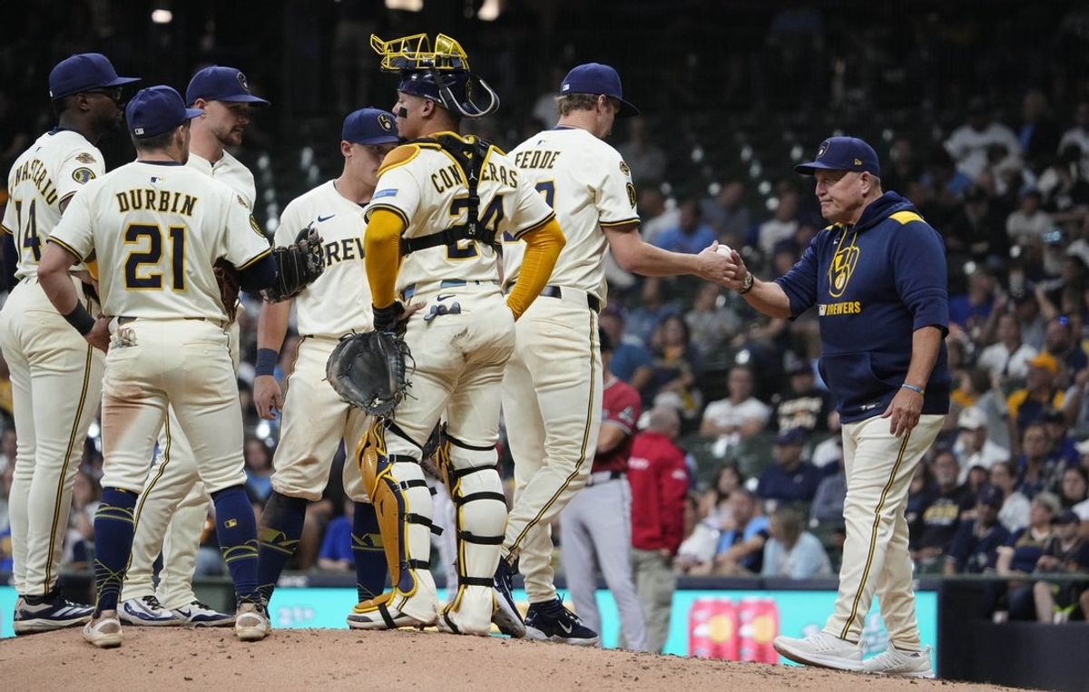 Aug 27, 2025; Milwaukee, Wisconsin, USA; Milwaukee Brewers manager Pat Murphy (49) takes Milwaukee Brewers pitcher Erick Fedde (59) out of the game against the Arizona Diamondbacks in the seventh  at American Family Field. Mandatory Credit: Michael McLoone-Imagn Images