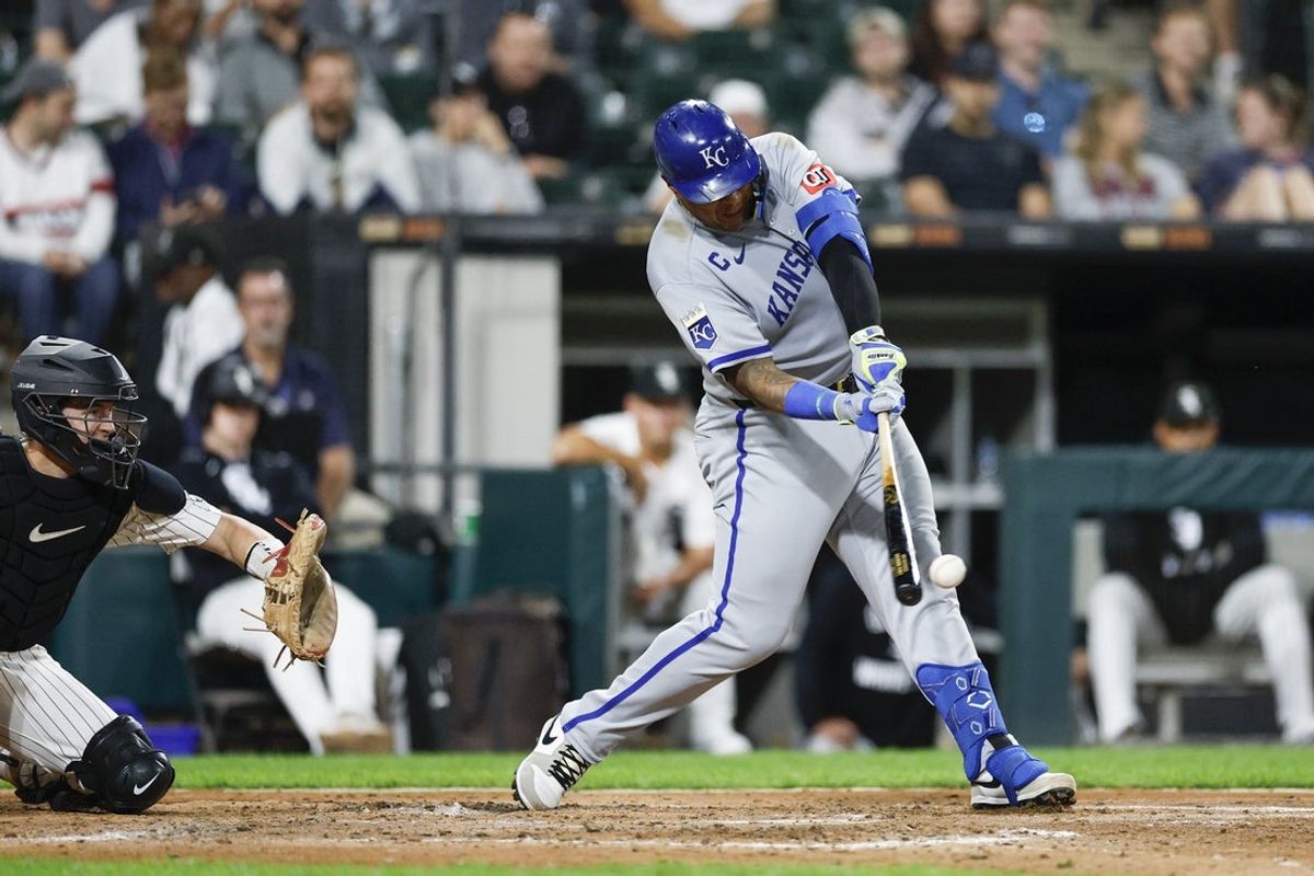 Aug 27, 2025; Chicago, Illinois, USA; Kansas City Royals catcher Salvador Perez (13) hits a two-run double against the Chicago White Sox during the fifth inning at Rate Field. Mandatory Credit: Kamil Krzaczynski-Imagn Images