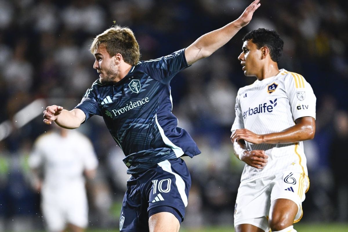 Aug 27, 2025; Carson, California, USA; Seattle Sounders FC forward Pedro de la Vega (10) follows through on a kick for a goal in front of LA Galaxy midfielder Edwin Cerrillo (6) during the first half at Dignity Health Sports Park. Mandatory Credit: Kelvin Kuo-Imagn Images