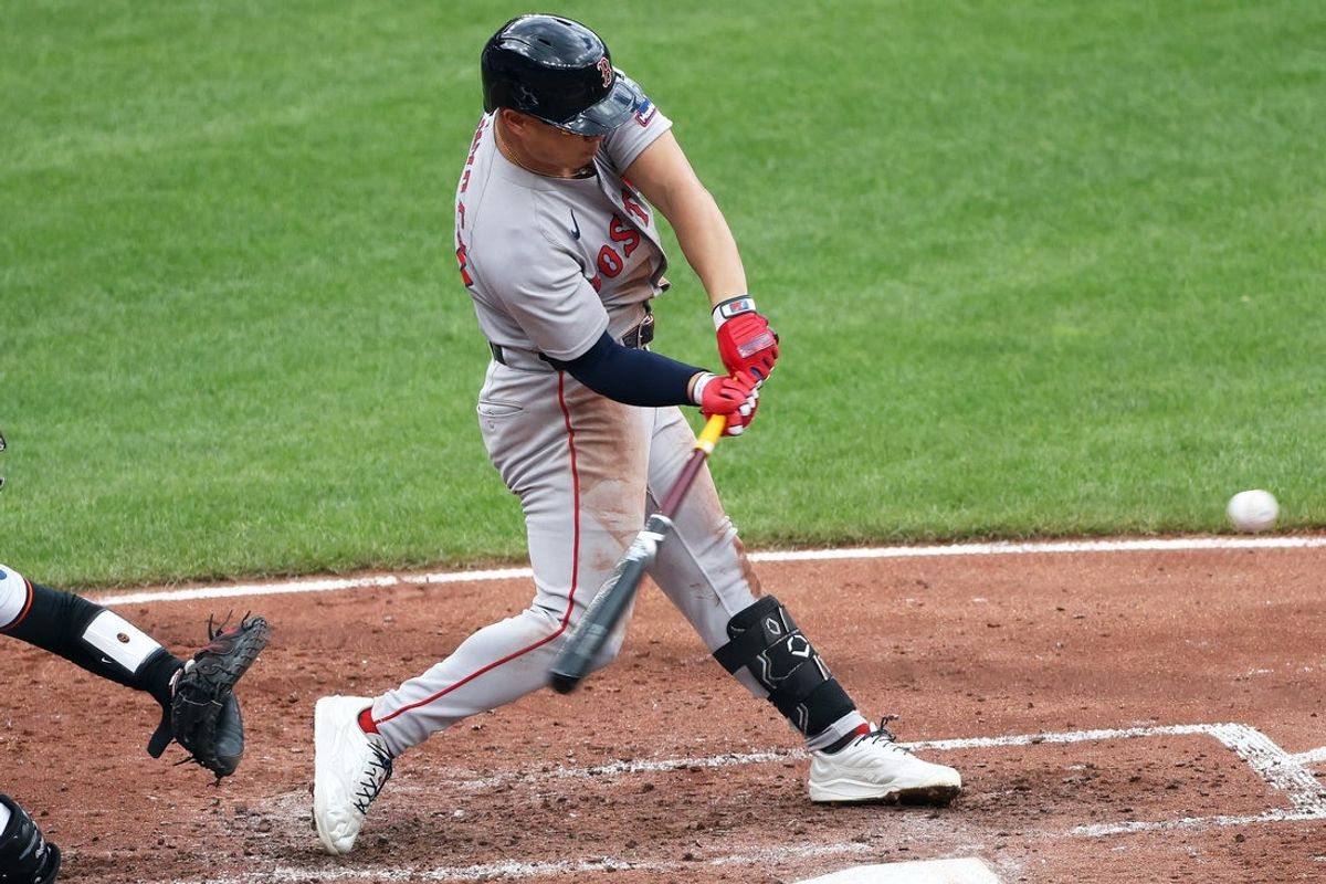 Aug 28, 2025; Baltimore, Maryland, USA; Boston Red Sox outfielder Rob Refsnyder (30) hits a solo home run during the fourth inning against the Baltimore Orioles at Oriole Park at Camden Yards. Mandatory Credit: Daniel Kucin Jr.-Imagn Images