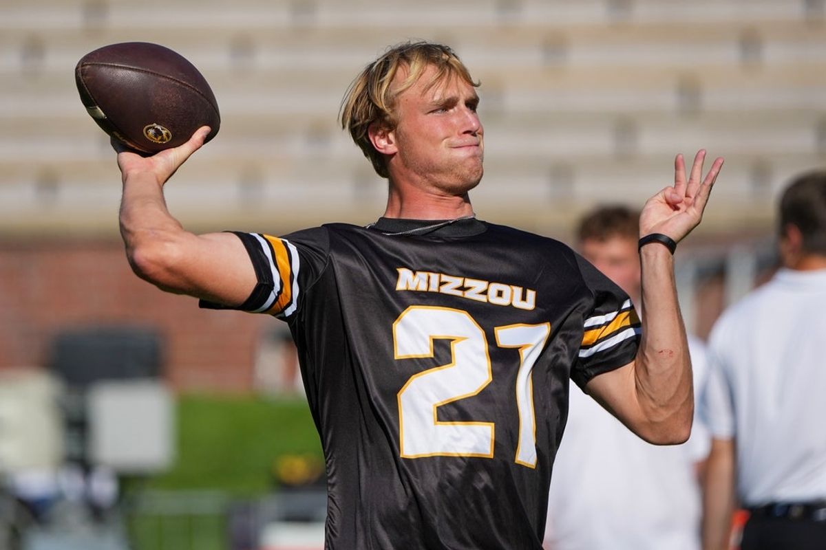 Aug 28, 2025; Columbia, Missouri, USA; Missouri Tigers quarterback Sam Horn (21) warms up against the Central Arkansas Bears prior to a game at Faurot Field at Memorial Stadium. Mandatory Credit: Denny Medley-Imagn Images