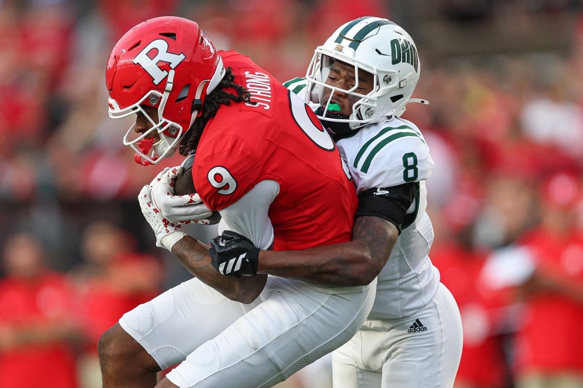 Aug 28, 2025; Piscataway, New Jersey, USA;  Rutgers Scarlet Knights wide receiver Ian Strong (9) is tackled by Ohio Bobcats cornerback Jaymar Mundy (8) during the first half at SHI Stadium. Mandatory Credit: Vincent Carchietta-Imagn Images