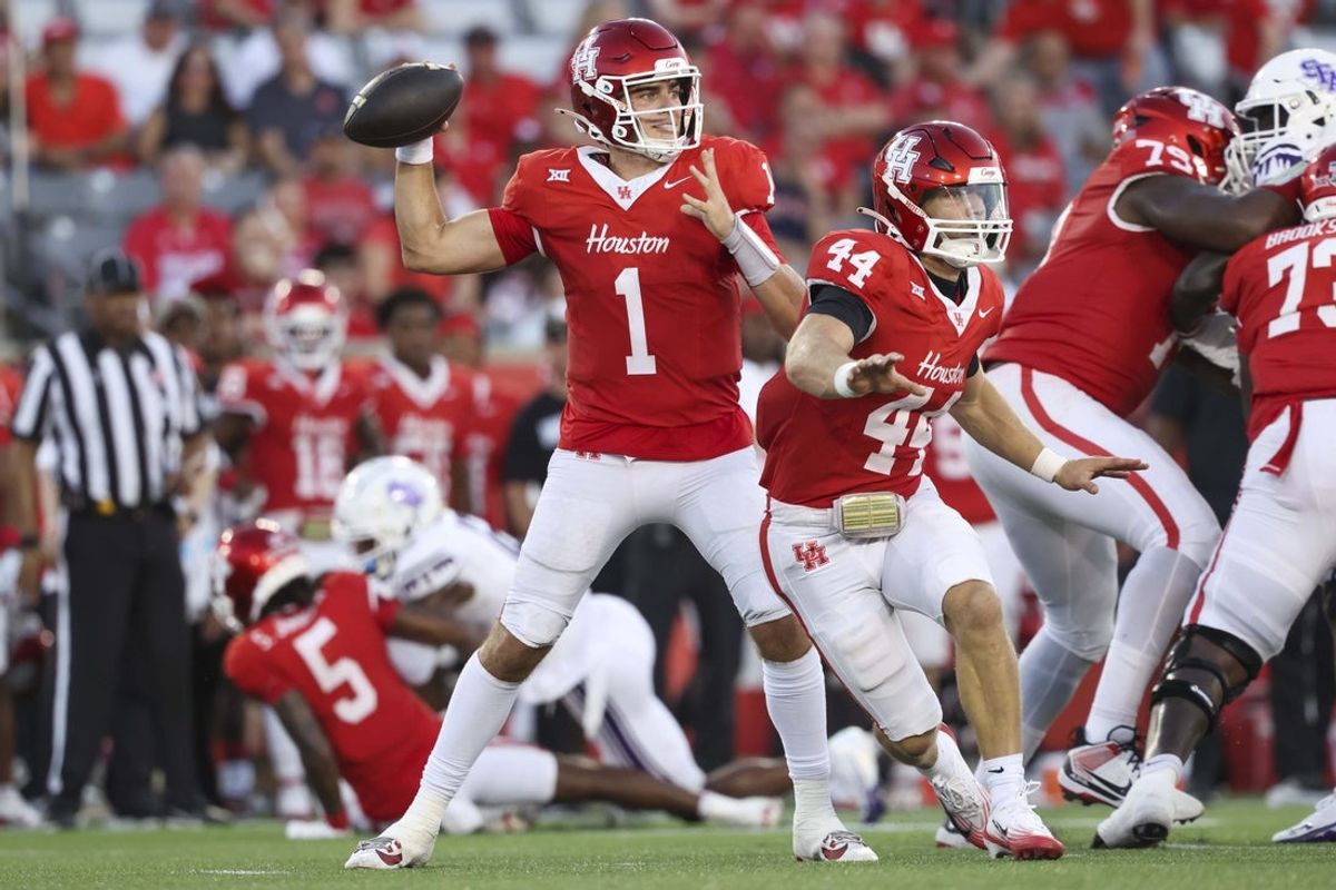Aug 28, 2025; Houston, Texas, USA; Houston Cougars quarterback Conner Weigman (1) attempts a pass during the first quarter against the Stephen F. Austin Lumberjacks at TDECU Stadium. Mandatory Credit: Troy Taormina-Imagn Images