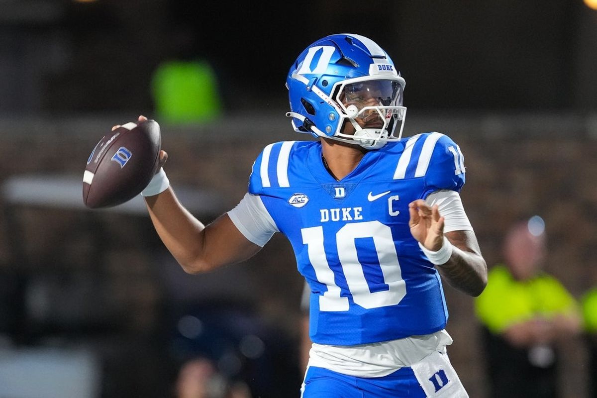 Aug 28, 2025; Durham, North Carolina, USA;  Duke Blue Devils quarterback Darian Mensah (10) goes to throw the ball against the Elon Phoenix during the first half at Wallace Wade Stadium. Mandatory Credit: James Guillory-Imagn Images
