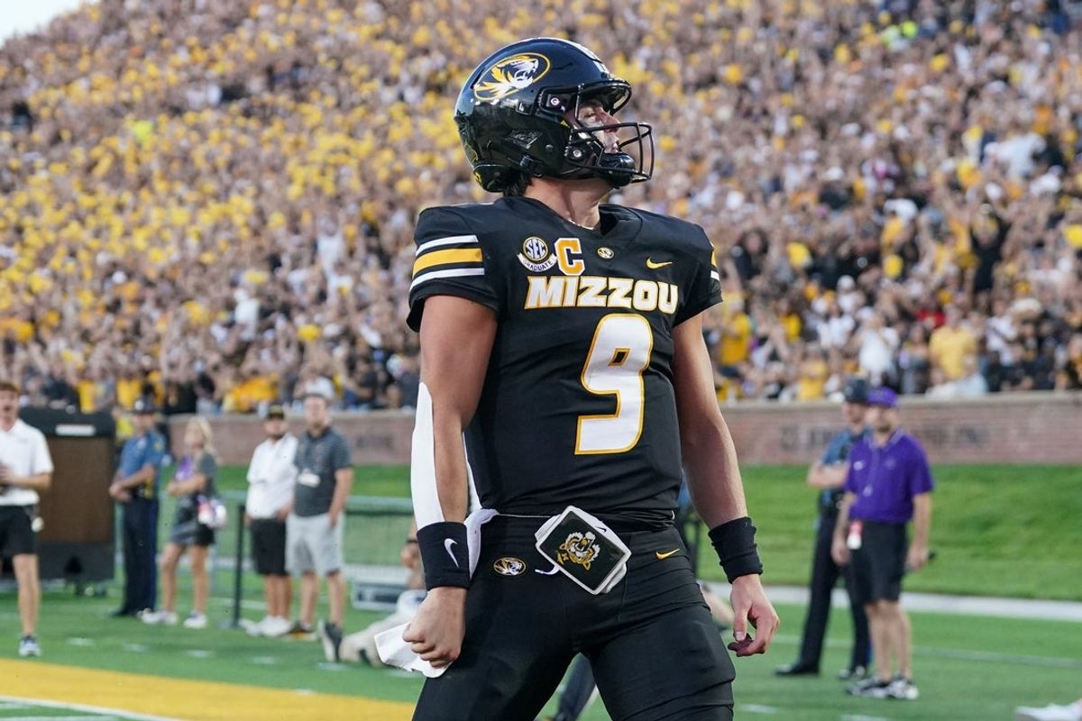 Aug 28, 2025; Columbia, Missouri, USA; Missouri Tigers quarterback Beau Pribula (9) celebrates after scoring against the Central Arkansas Bears during the first half of the game at Faurot Field at Memorial Stadium. Mandatory Credit: Denny Medley-Imagn Images