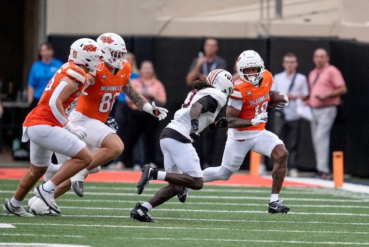 Oklahoma State wide receiver Sam Jackson V (18) runs the ball in the first quarter during an NCAA football game between Oklahoma State (OSU) and UT Martin in Stillwater, Okla., on Thursday, Aug. 28, 2025.