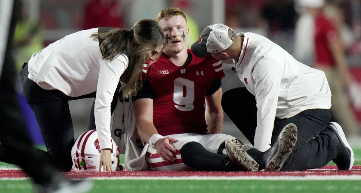 Wisconsin quarterback Billy Edwards Jr. (9) is tended to after being injured during the second quarter of their game against Miami (Ohio) Thursday, August 28, 2025 at Camp Randall Stadium in Madison, Wisconsin.
