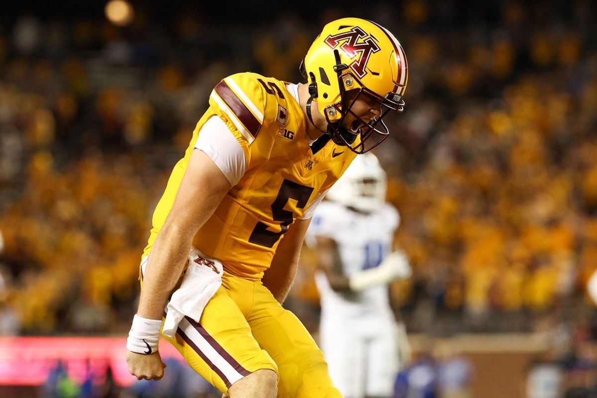 Aug 28, 2025; Minneapolis, Minnesota, USA; Minnesota Golden Gophers quarterback Drake Lindsey (5) celebrates wide receiver Jalen Smith's (8) touchdown against the Buffalo Bulls during the second half of the game at Huntington Bank Stadium. Mandatory Credit: Matt Krohn-Imagn Images