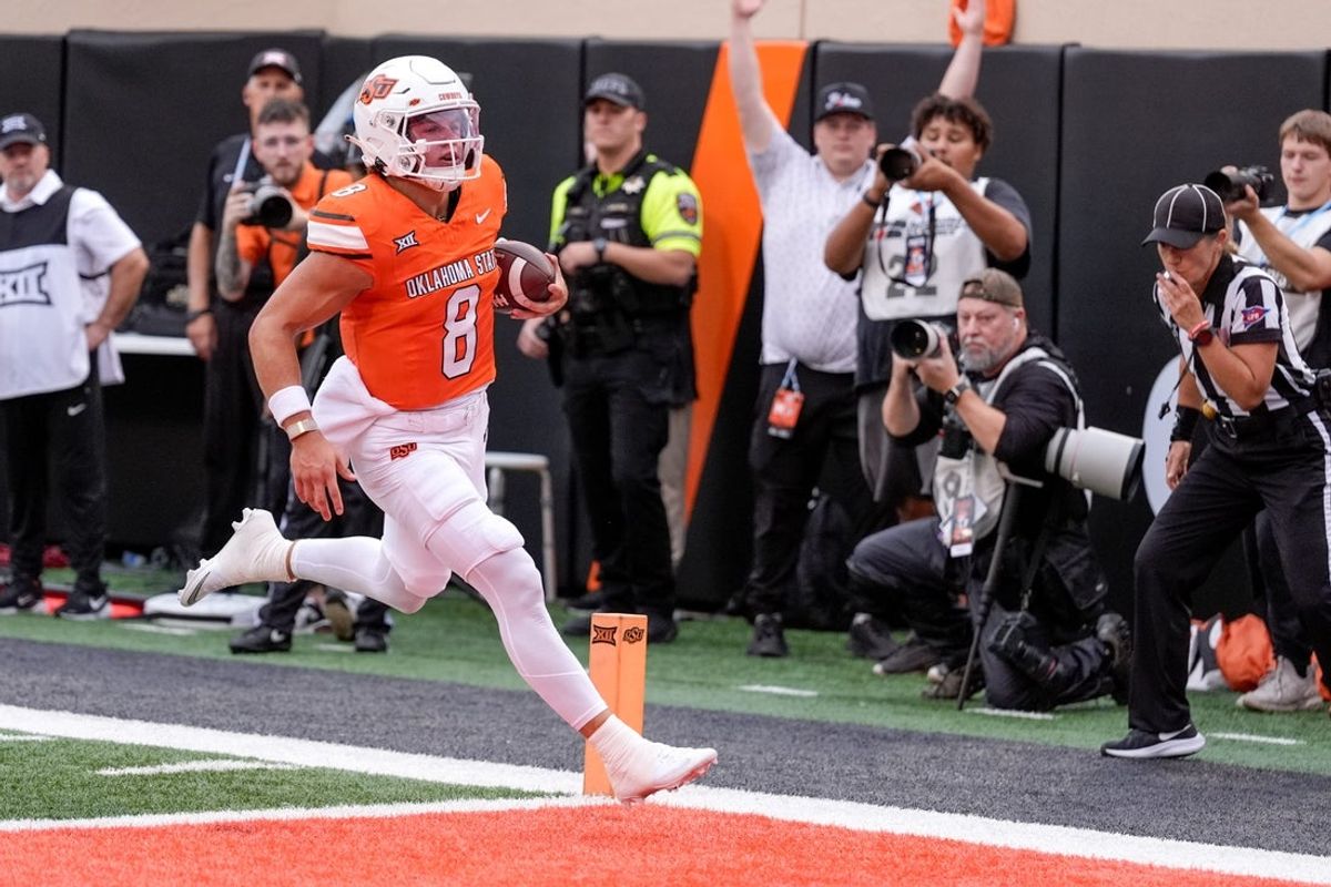 Oklahoma State quarterback Hauss Hejny (8) runs the ball for a touchdown in the first quarter during an NCAA football game between Oklahoma State (OSU) and UT Martin in Stillwater, Okla., on Thursday, Aug. 28, 2025.