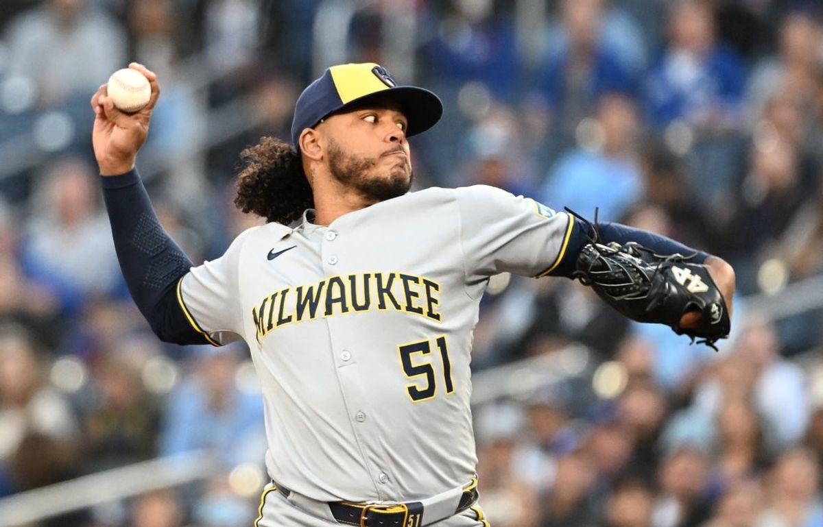 Aug 29, 2025; Toronto, Ontario, CAN;  Milwaukee Brewers starting pitcher Freddy Peralta (51) delivers a pitch against the Toronto Blue Jays in the first inning at Rogers Centre. Mandatory Credit: Dan Hamilton-Imagn Images