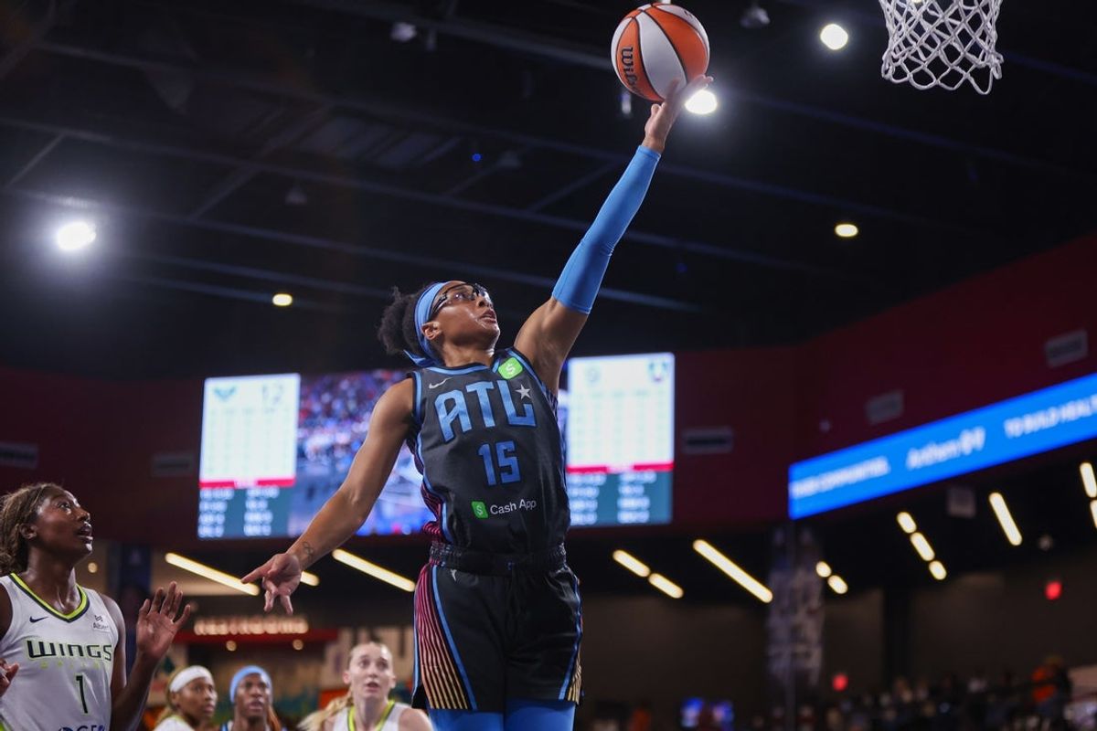 Aug 29, 2025; College Park, Georgia, USA; Atlanta Dream guard Allisha Gray (15) shoots against the Dallas Wings in the first quarter at Gateway Center Arena at College Park. Mandatory Credit: Brett Davis-Imagn Images