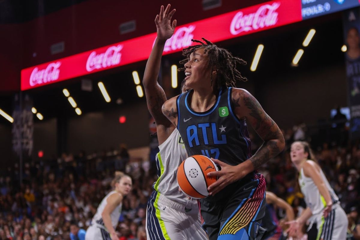 Aug 29, 2025; College Park, Georgia, USA; Atlanta Dream center Brittney Griner (42) drives to the basket against the Dallas Wings in the second quarter at Gateway Center Arena at College Park. Mandatory Credit: Brett Davis-Imagn Images