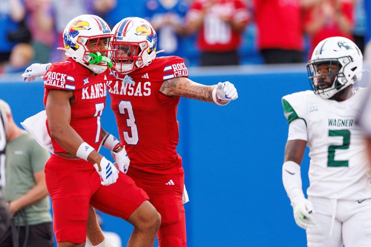 Aug 29, 2025; Lawrence, Kansas, USA; Kansas Jayhawks wide receiver Cam Pickett (7) and Kansas Jayhawks wide receiver Keaton Kubecka (3) celebrate after a touchdown during the first half against the Wagner Seahawks at David Booth Kansas Memorial Stadium. Mandatory Credit: William Purnell-Imagn Images