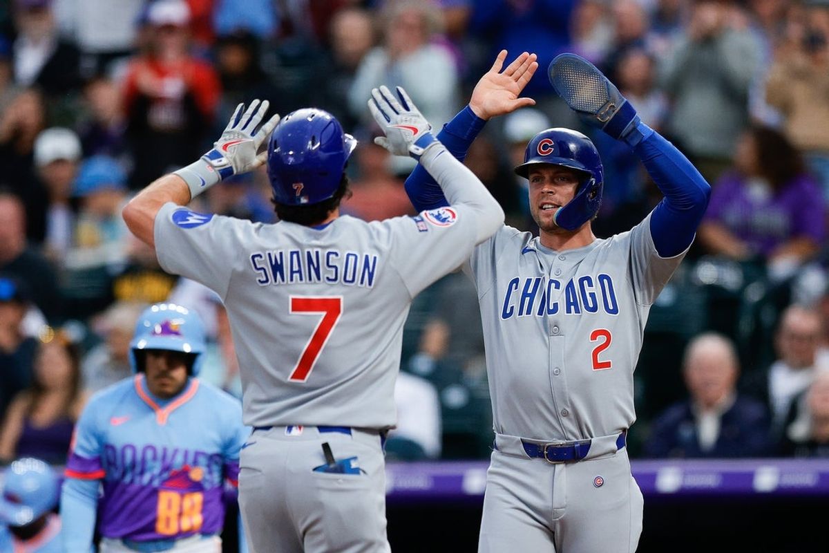 Aug 29, 2025; Denver, Colorado, USA; Chicago Cubs second baseman Nico Hoerner (2) celebrates the two run home run of shortstop Dansby Swanson (7) in the second inning against the Colorado Rockies at Coors Field. Mandatory Credit: Isaiah J. Downing-Imagn Images