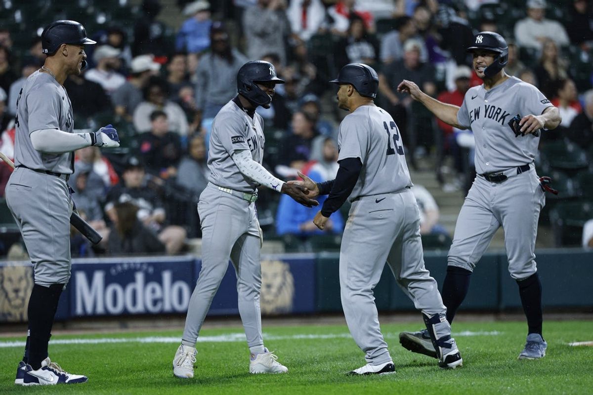 Aug 29, 2025; Chicago, Illinois, USA; New York Yankees center fielder Trent Grisham (12) celebrates with teammates after hitting a grand slam against the Chicago White Sox during the fourth inning at Rate Field. Mandatory Credit: Kamil Krzaczynski-Imagn Images