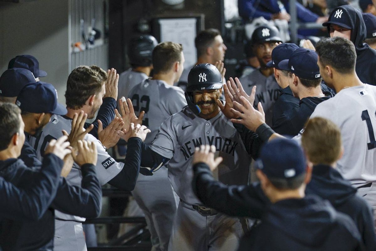 Aug 29, 2025; Chicago, Illinois, USA; New York Yankees center fielder Trent Grisham (12) celebrates with teammates after hitting a grand slam against the Chicago White Sox during the fourth inning at Rate Field. Mandatory Credit: Kamil Krzaczynski-Imagn Images