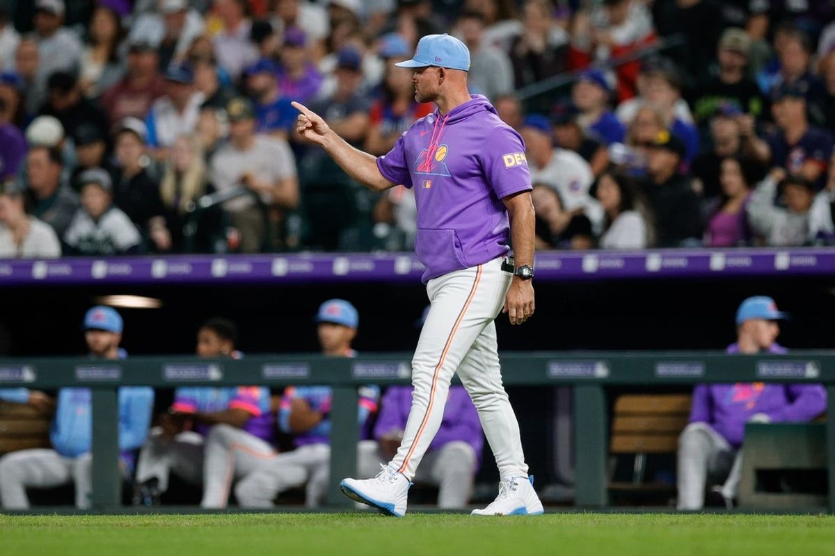 Aug 29, 2025; Denver, Colorado, USA; Colorado Rockies interim manager Warren Schaeffer (34) gestures for a pitching change in the fifth inning against the Chicago Cubs at Coors Field. Mandatory Credit: Isaiah J. Downing-Imagn Images