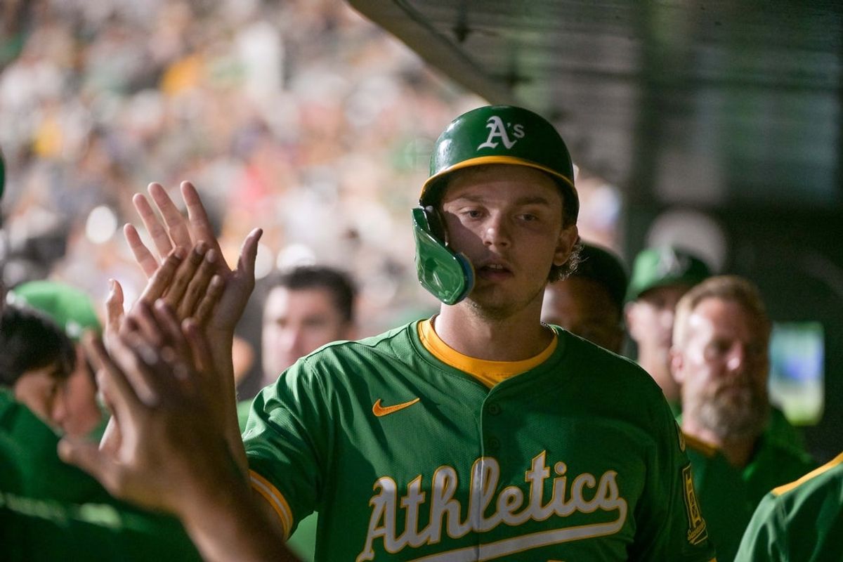 Aug 29, 2025; West Sacramento, California, USA; Athletics first baseman Nick Kurtz (16) high fives team mates after scoring against the Texas Rangers during the third inning at Sutter Health Park. Mandatory Credit: Ed Szczepanski-Imagn Images