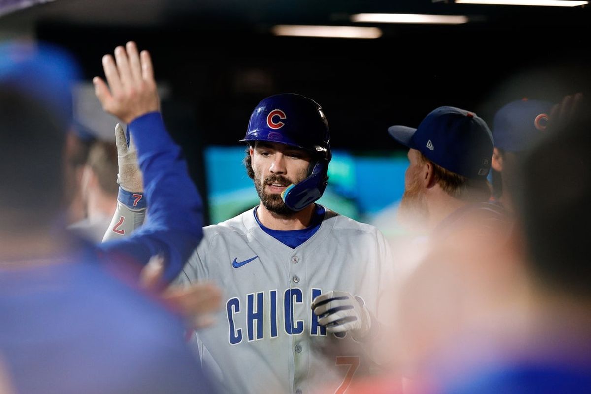 Aug 29, 2025; Denver, Colorado, USA; Chicago Cubs shortstop Dansby Swanson (7) celebrates in the dugout on a solo home run in the seventh inning against the Colorado Rockies at Coors Field. Mandatory Credit: Isaiah J. Downing-Imagn Images