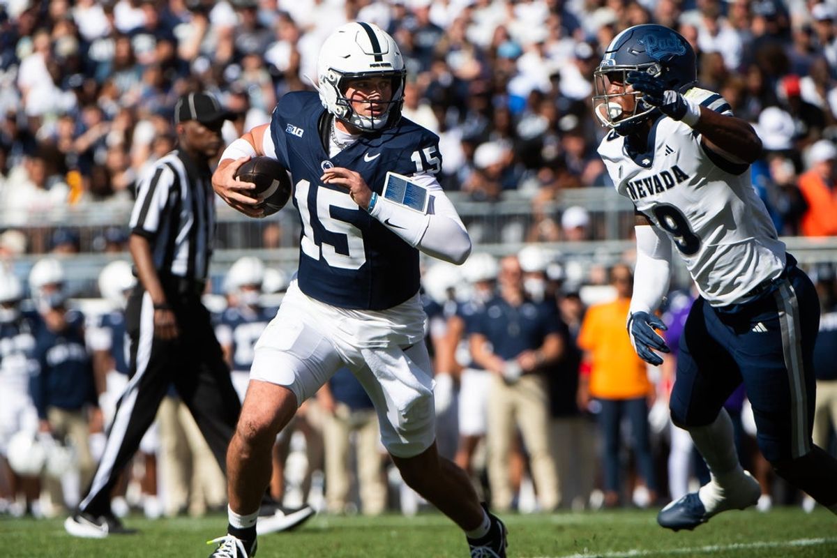 Penn State quarterback Drew Allar runs with the ball in the first half of an NCAA football game against Nevada, Saturday, August 30, 2025, in State College, Pa.
