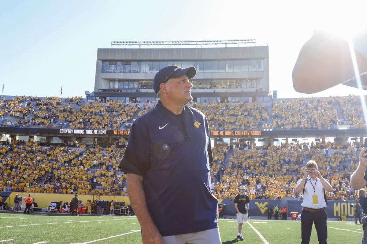 Aug 30, 2025; Morgantown, West Virginia, USA; West Virginia Mountaineers head coach Rich Rodriguez sings “Country Roads” after defeating the Robert Morris Colonials at Milan Puskar Stadium. Mandatory Credit: Ben Queen-Imagn Images