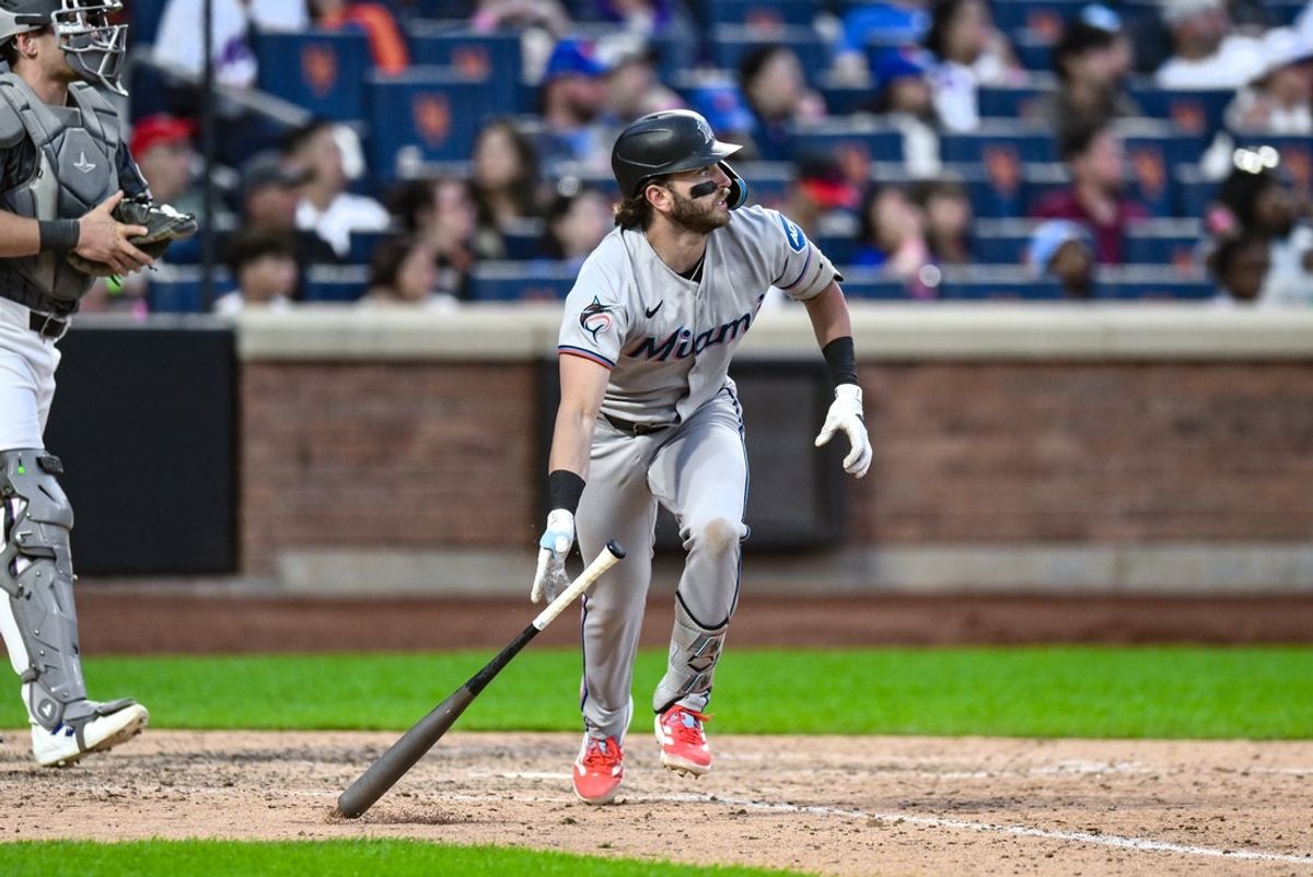 Aug 30, 2025; New York City, New York, USA; Miami Marlins third baseman Connor Norby (1) hits a two-RBI double against the New York Mets during the ninth inning at Citi Field. Mandatory Credit: John Jones-Imagn Images