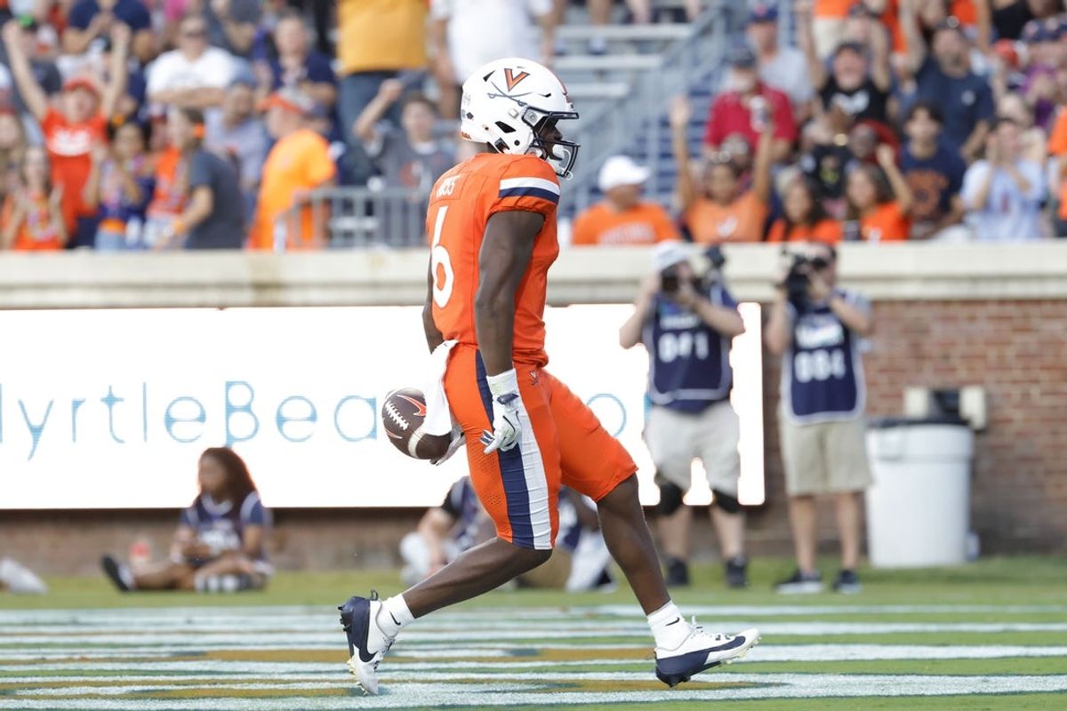 Aug 30, 2025; Charlottesville, Virginia, USA; Virginia Cavaliers wide receiver Cam Ross (6) scores a touchdown against the Coastal Carolina Chanticleers during the second quarter at Scott Stadium. Mandatory Credit: Amber Searls-Imagn Images