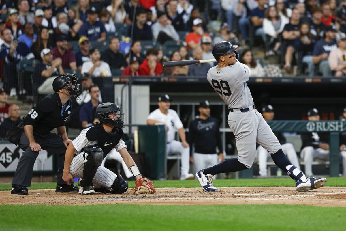 Aug 30, 2025; Chicago, Illinois, USA; New York Yankees designated hitter Aaron Judge (99) hits a solo home run against the Chicago White Sox during the fourth inning at Rate Field. Mandatory Credit: Kamil Krzaczynski-Imagn Images