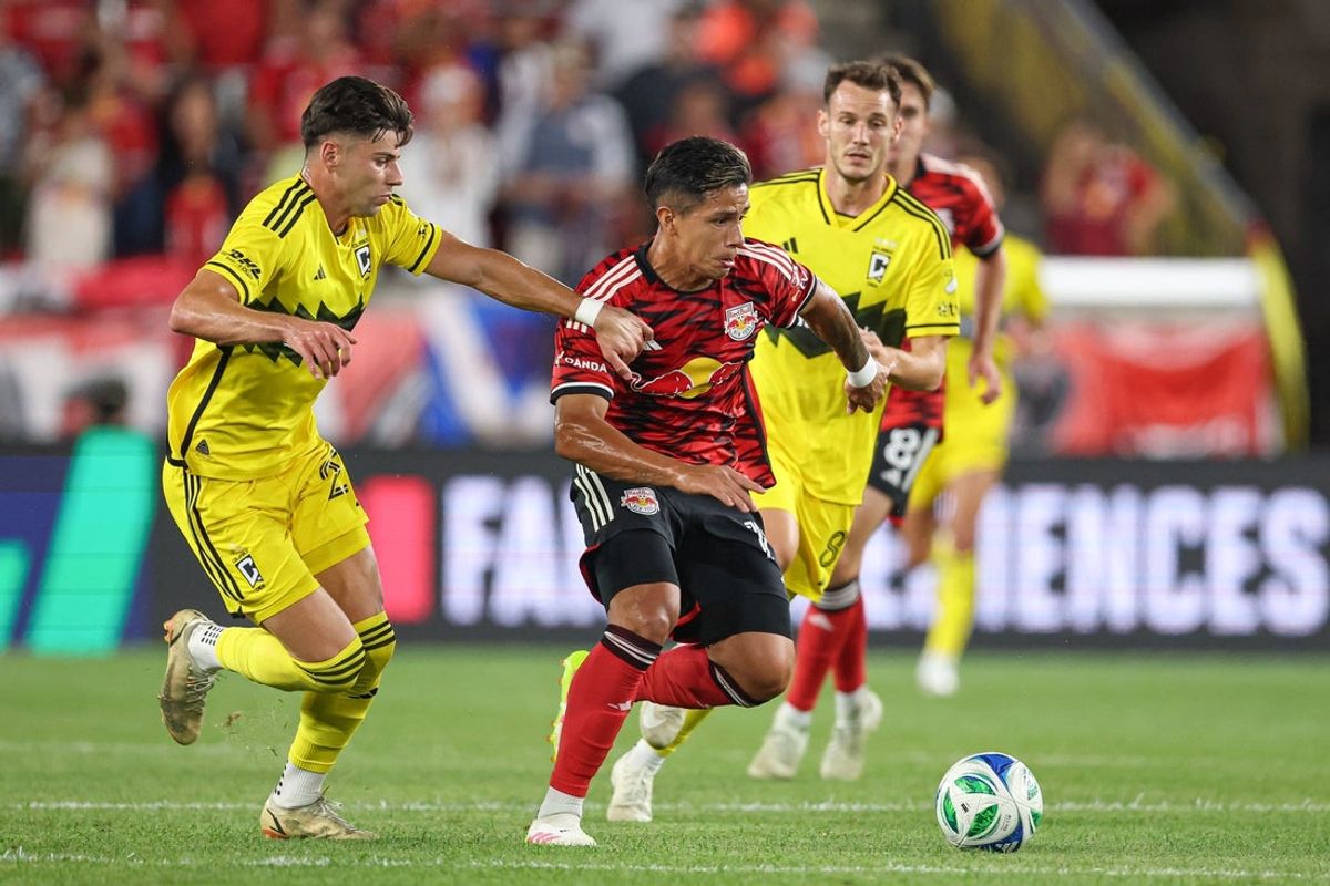 Aug 30, 2025; Harrison, New Jersey, USA; New York Red Bulls midfielder Wiki Carmona (19) plays the ball in front of Columbus Crew midfielder Daniel Gazdag (8) and midfielder Maximilian Arfsten (27) during the first half at Sports Illustrated Stadium. Mandatory Credit: Vincent Carchietta-Imagn Images