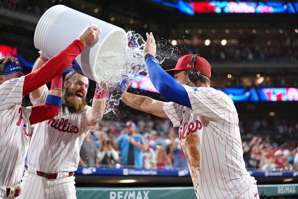 Aug 30, 2025; Philadelphia, Pennsylvania, USA; Philadelphia Phillies infielder Trea Turner (7) is showered by teammates after the game against the Atlanta Braves at Citizens Bank Park. Mandatory Credit: Kyle Ross-Imagn Images