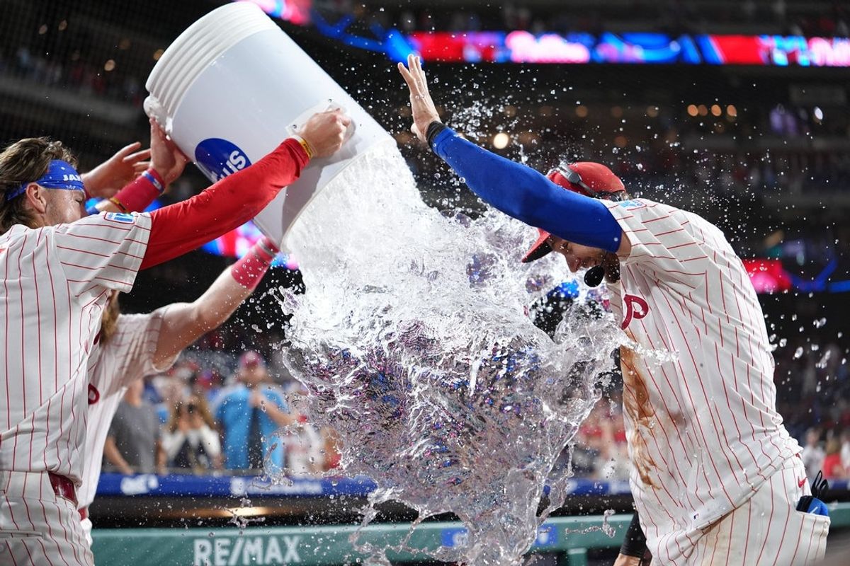 Aug 30, 2025; Philadelphia, Pennsylvania, USA; Philadelphia Phillies infielder Trea Turner (7) is showered by teammates after the game against the Atlanta Braves at Citizens Bank Park. Mandatory Credit: Kyle Ross-Imagn Images
