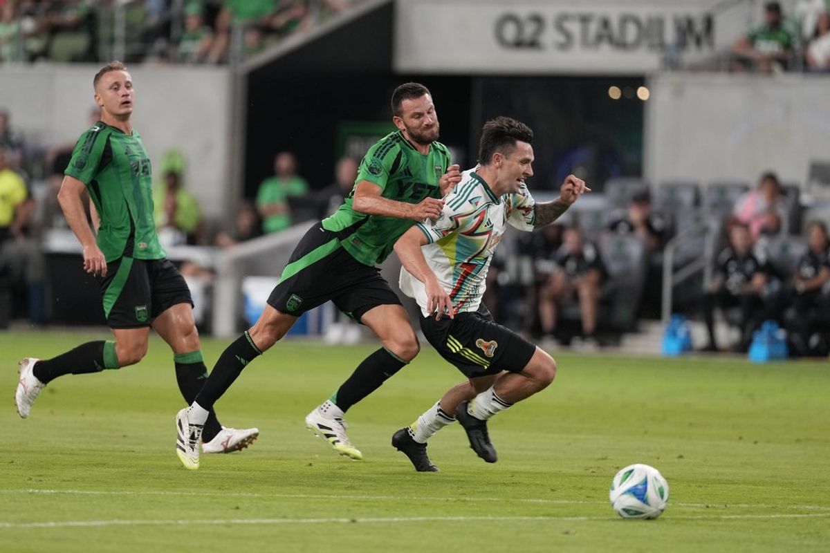 Aug 30, 2025; Austin, Texas, USA; Austin FC defender Brendan Hines-Ike (4) pushes San Jose Earthquakes forward Preston Judd (19) to the ground during the first half at Q2 Stadium. Mandatory Credit: Scott Wachter-Imagn Images