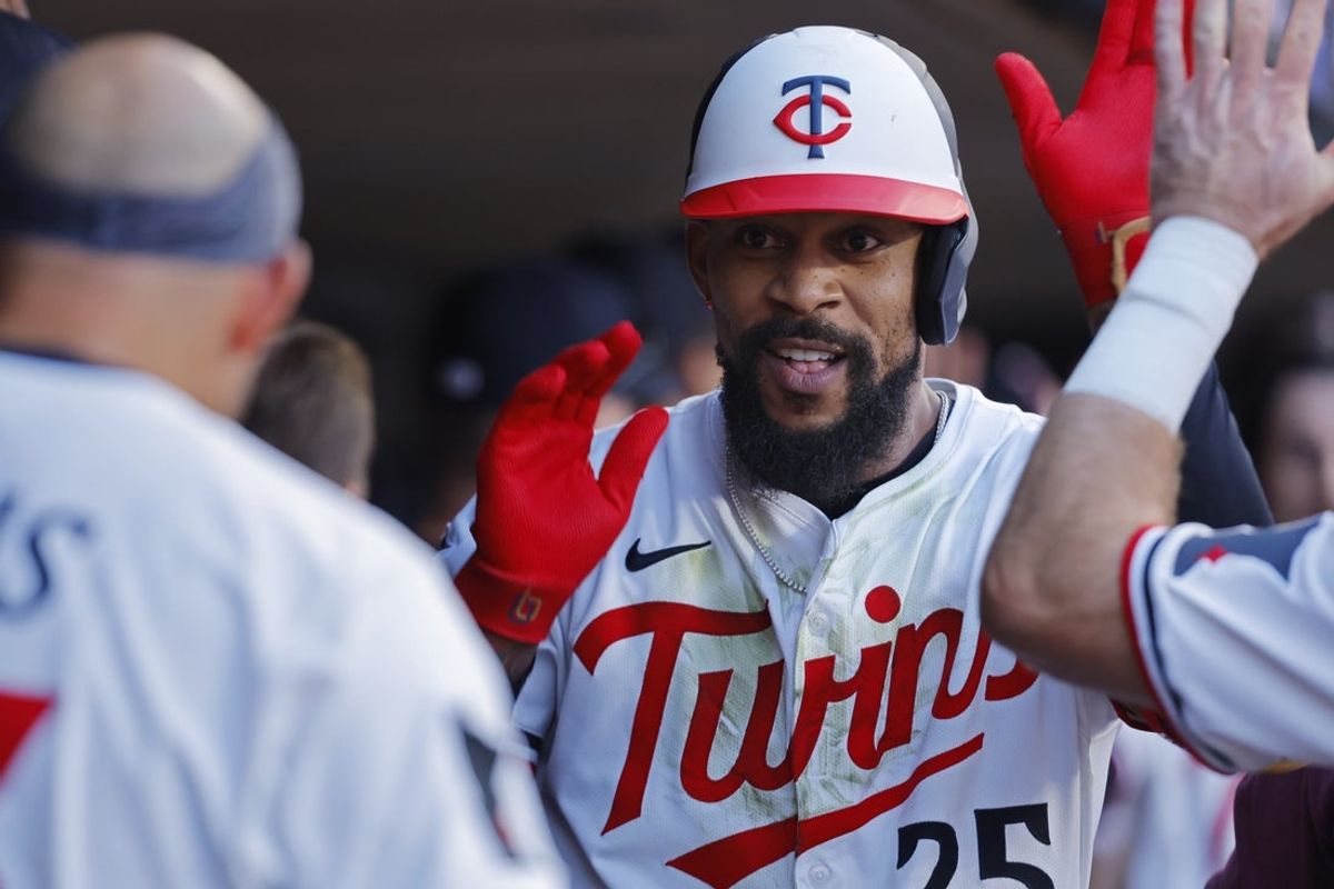 Aug 30, 2025; Minneapolis, Minnesota, USA; Minnesota Twins center fielder Byron Buxton (25) celebrates his two-run homer against the San Diego Padres in the fifth inning at Target Field. Mandatory Credit: Bruce Kluckhohn-Imagn Images