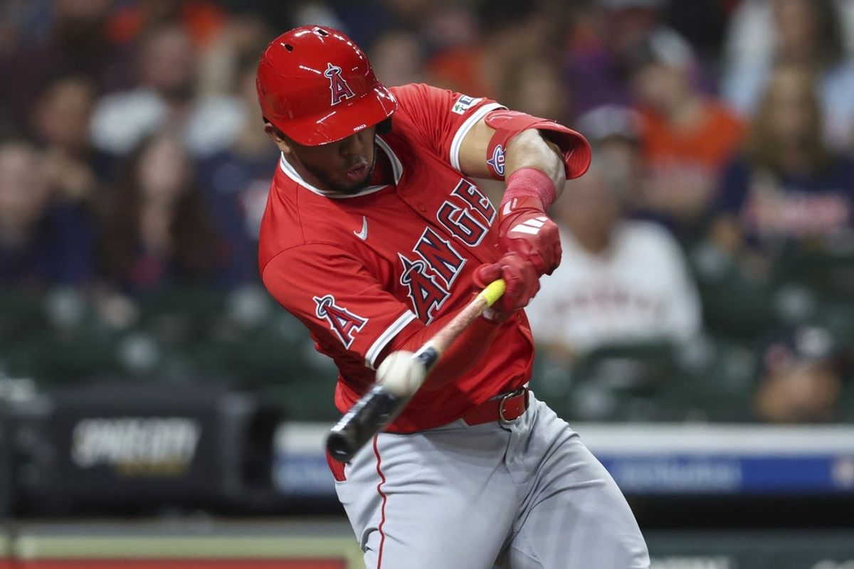 Aug 30, 2025; Houston, Texas, USA; Los Angeles Angels first baseman Oswald Peraza (10) drives in two runs with an RBI double during the ninth inning against the Houston Astros at Daikin Park. Mandatory Credit: Troy Taormina-Imagn Images