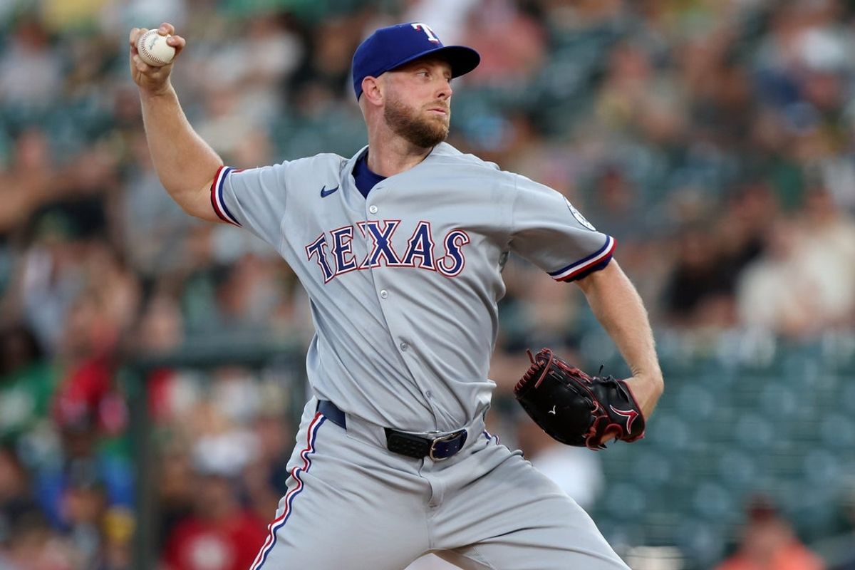 Aug 30, 2025; West Sacramento, California, USA; Texas Rangers starting pitcher Merrill Kelly (23) throws a pitch against the Athletics during the first inning at Sutter Health Park. Mandatory Credit: Dennis Lee-Imagn Images