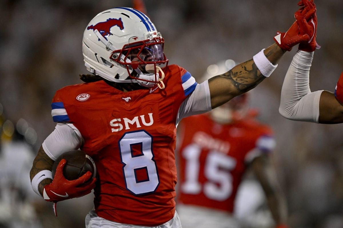 Aug 30, 2025; Dallas, Texas, USA; Southern Methodist Mustangs wide receiver Yamir Knight (8) celebrates during a punt return against the East Texas A&M Lions during the first half at Gerald J. Ford Stadium. Mandatory Credit: Jerome Miron-Imagn Images
