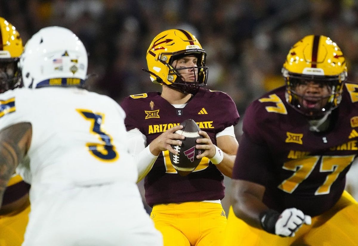 Arizona State quarterback Sam Leavitt (10) looks for a receiver against NAU during a game at Mountain America Stadium in Tempe on Aug. 30, 2025.