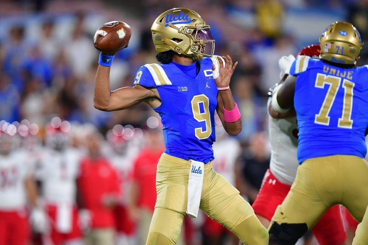 Aug 30, 2025; Pasadena, California, USA; UCLA Bruins quarterback Nico Iamaleava (9) throws against the Utah Utes during the second half at Rose Bowl. Mandatory Credit: Gary A. Vasquez-Imagn Images