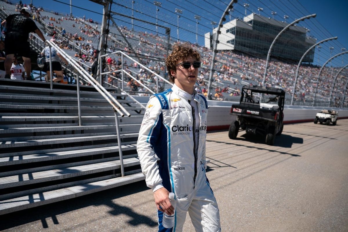 NTT IndyCar Series driver David Malukas (4) heads to his car before the Music City Grand Prix at the Nashville Superspeedway in Lebanon, Tenn., Sunday, Aug. 31, 2025.