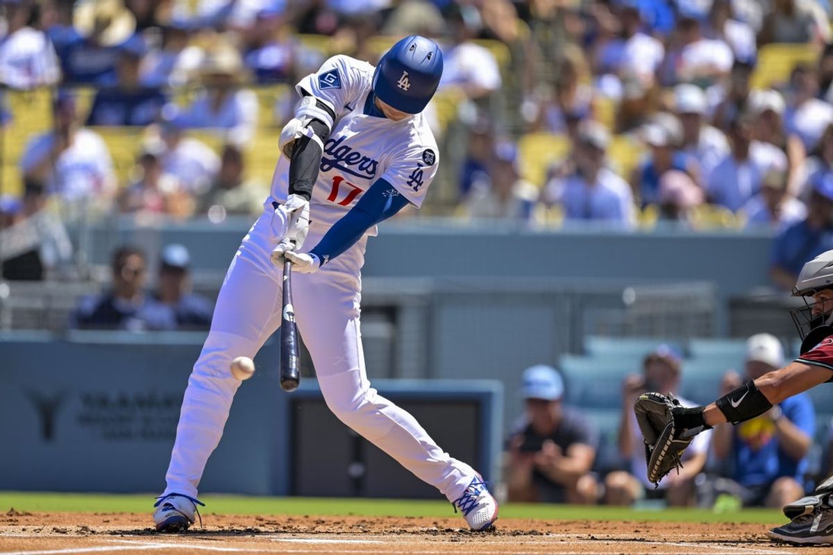 Aug 31, 2025; Los Angeles, California, USA; Los Angeles Dodgers designated hitter Shohei Ohtani (17) hits a single during the first inning at Dodger Stadium. Mandatory Credit: Jayne Kamin-Oncea-Imagn Images