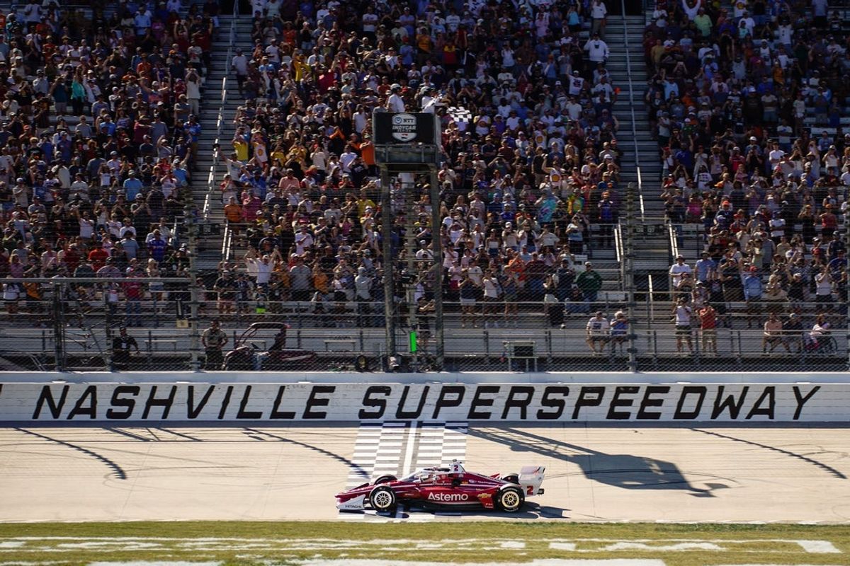 NTT IndyCar Series driver Josef Newgarden crosses the finish line winning the Music City Grand Prix at the Nashville Superspeedway in Lebanon, Tenn., Sunday, Aug. 31, 2025.