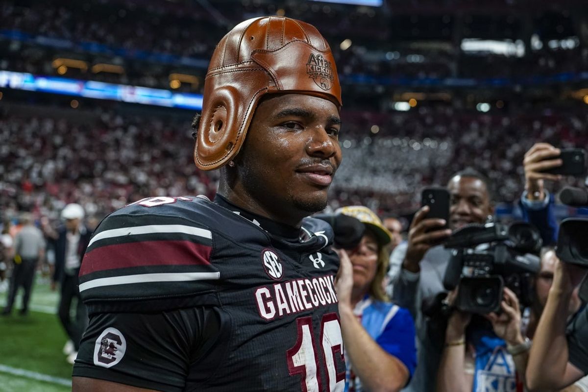 Aug 31, 2025; Atlanta, Georgia, USA; South Carolina Gamecocks quarterback LaNorris Sellers (16) wears the Old Leather Helmet after defeating the Virginia Tech Hokies at Mercedes-Benz Stadium. Mandatory Credit: Dale Zanine-Imagn Images