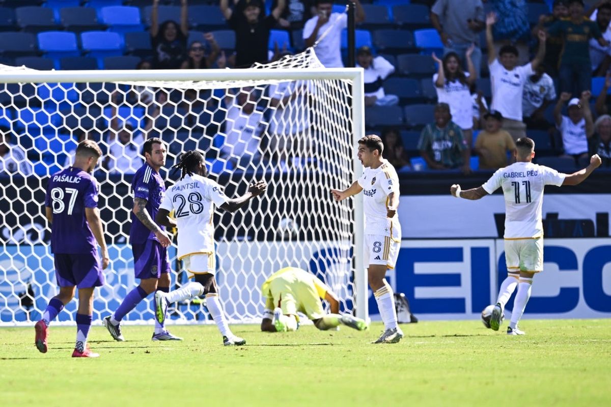 Aug 31, 2025; Carson, California, USA; LA Galaxy forward Joseph Paintsil (28) celebrates his goal with midfielder Lucas Sanabria (8) during the second half against Orlando City SC at Dignity Health Sports Park. Mandatory Credit: Kelvin Kuo-Imagn Images