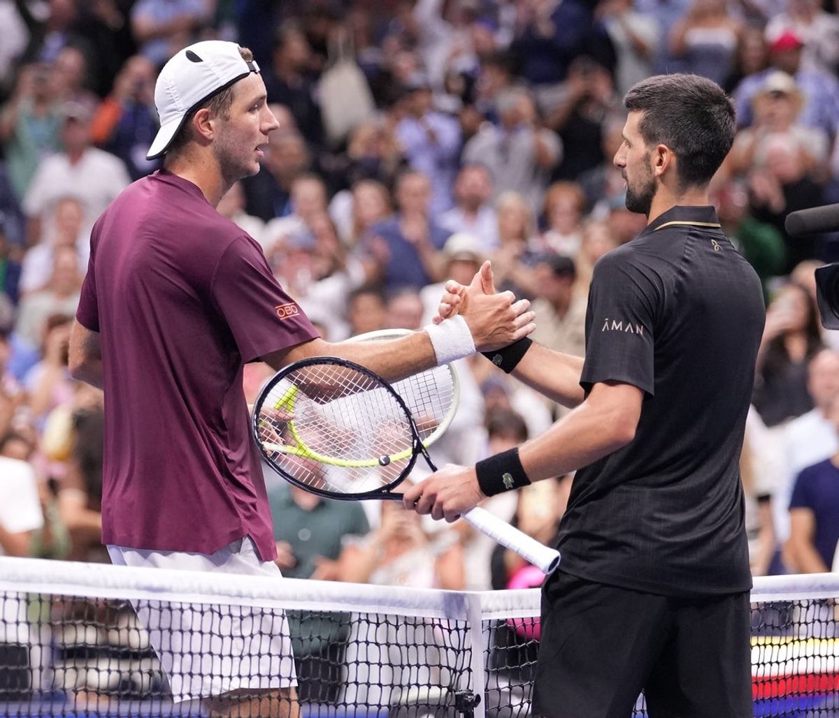 Aug 31, 2025; Flushing, NY, USA;  Novak Djokovic (right) (SRB) after beating Jan-Lennard Struff (GER) (left) on day eight of the 2025 U.S. Open tennis tournament at the USTA Billie Jean King National Tennis Center. Mandatory Credit: Robert Deutsch-Imagn Images