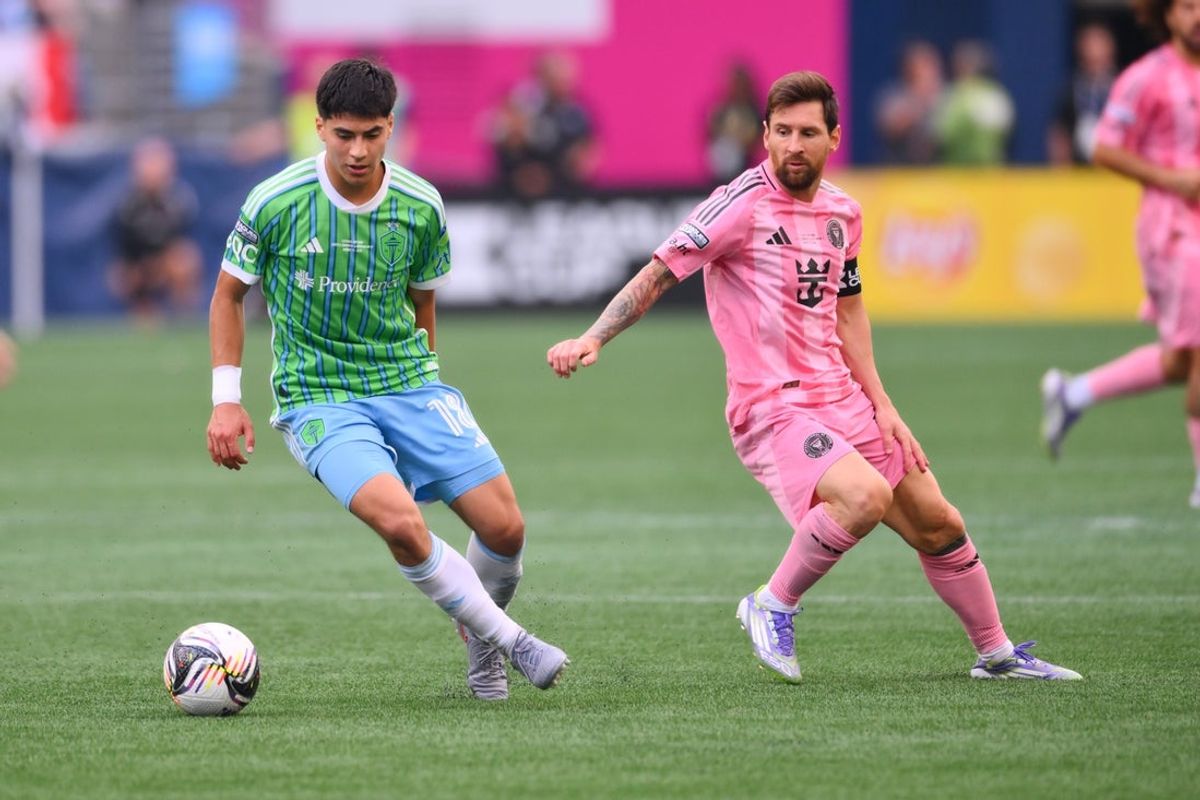 Aug 31, 2025; Seattle, Washington, USA; Seattle Sounders FC midfielder Obed Vargas (18) defends the bal form Inter Miami CF forward Lionel Messi (10) during the first half at Lumen Field. Mandatory Credit: Steven Bisig-Imagn Images